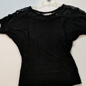 Jennifer Lopez black sweater with lace detail
